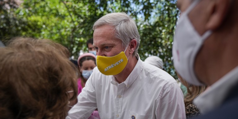 Presidential candidate Jose Antonio Kast, from the Republican Party, greets supporters as he campaigns in Santiago, Chile, Tuesday, Nov. 2, 2021. Chile will hold its presidential election on Nov. 21. (AP Photo/Esteban Felix)