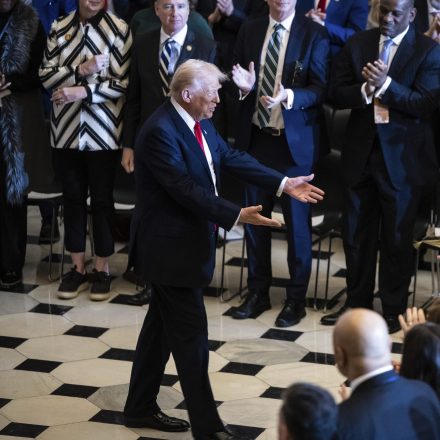 President Donald Trump reaches out to lawmakers as he prepares to depart the National Prayer Breakfast at the U.S. Capitol Feb. 6, 2025. (Francis Chung/POLITICO via AP Images)