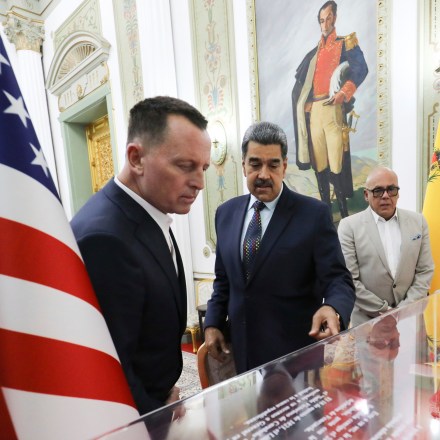This photo released by Venezuela's presidential press office shows Venezuelan President Nicolas Maduro, center, with Richard Grenell, President Donald Trump's special envoy, left at Miraflores presidential palace in Caracas, Venezuela, Jan. 31, 2025.