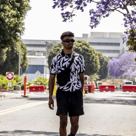 Marcos Leao, center, walks past a checkpoint manned by Marines after he was briefly detained and released on Friday, June 13, 2025, in Los Angeles.