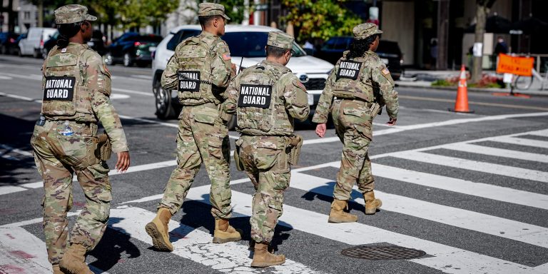 National Guard soldiers cross the street in downtown Washington, D.C. near the White House.