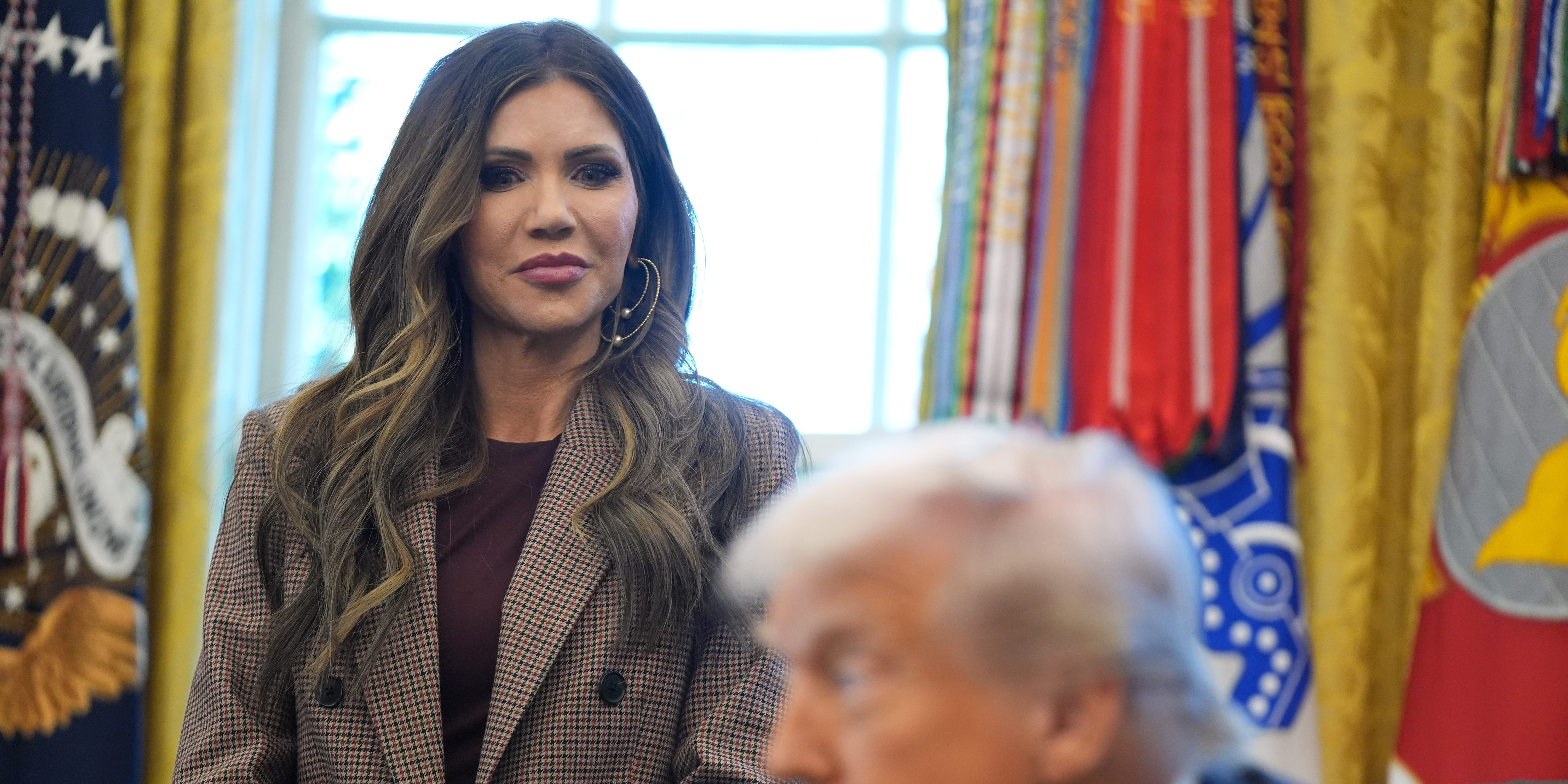 Homeland Security Secretary Kristi Noem listens as President Donald Trump speaks during a meeting with the White House task force on the 2026 FIFA World Cup in the Oval Office of the White House, Monday, Nov. 17, 2025, in Washington.