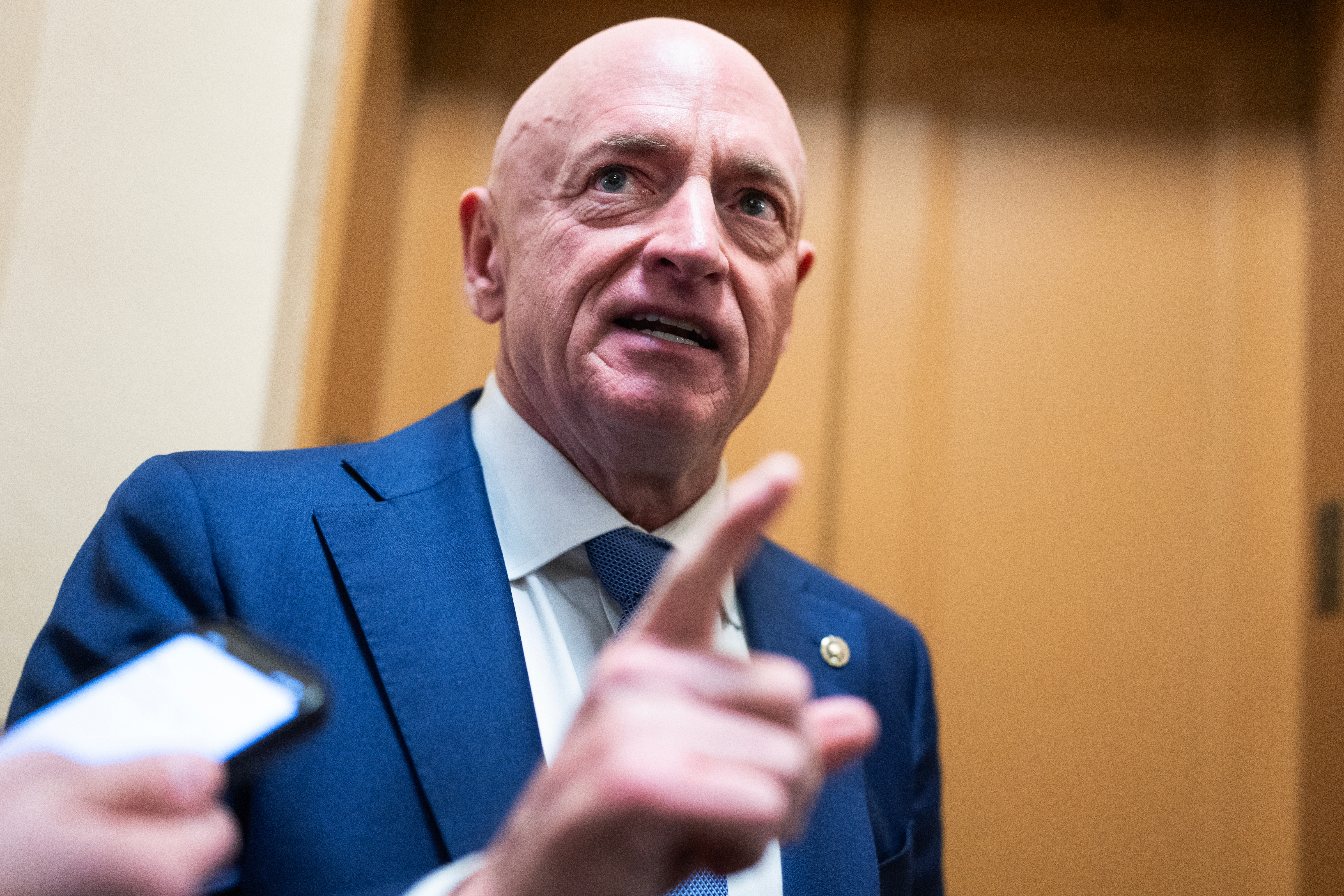 UNITED STATES - DECEMBER 9: Sen. Mark Kelly, D-Ariz., talks with reporters in the Senate subway on Tuesday, December 9, 2025. (Tom Williams/CQ Roll Call via AP Images)
