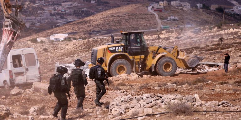 Israeli excavators demolish some of constructions belonging to Palestinians for allegedly being unauthorized at Dura district in Hebron, West Bank on September 23, 2020.
