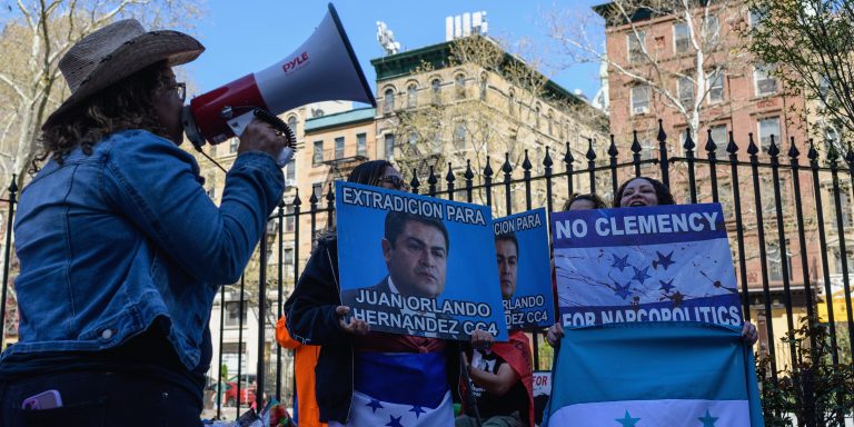 Honduran opponents to former President Juan Orlando Hernandez protest outside the federal court in Manhattan on April 22, 2022 in New York. - Ex-Honduran president Juan Orlando Hernandez made his first appearance before a US judge Friday following his extradition to America to face drug trafficking charges. (Photo by Angela Weiss / AFP) (Photo by ANGELA WEISS/AFP via Getty Images)
