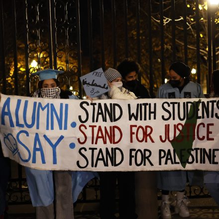 NEW YORK, NEW YORK - NOVEMBER 20: People gather to protest the banning of Students for Justice in Palestine (SJP) and Jewish Voice for Peace (JVP) at Columbia University on November 20, 2023 in New York City. Students, alumni of both schools, some dressed in caps and gowns, and supporters held a "Denouncement Ceremony" and pledged not to donate money to the schools after the banning of the student groups for holding a nonviolent but unsanctioned protest demanding a ceasefire in Gaza. More than 20 progressive elected officials have sent a letter to the university calling for the reinstatement of the groups. Calls for a ceasefire in Gaza continue as the death toll from Israel’s invasion of Gaza has increased in the weeks since the October 7 Hamas attack. (Photo by Michael M. Santiago/Getty Images)