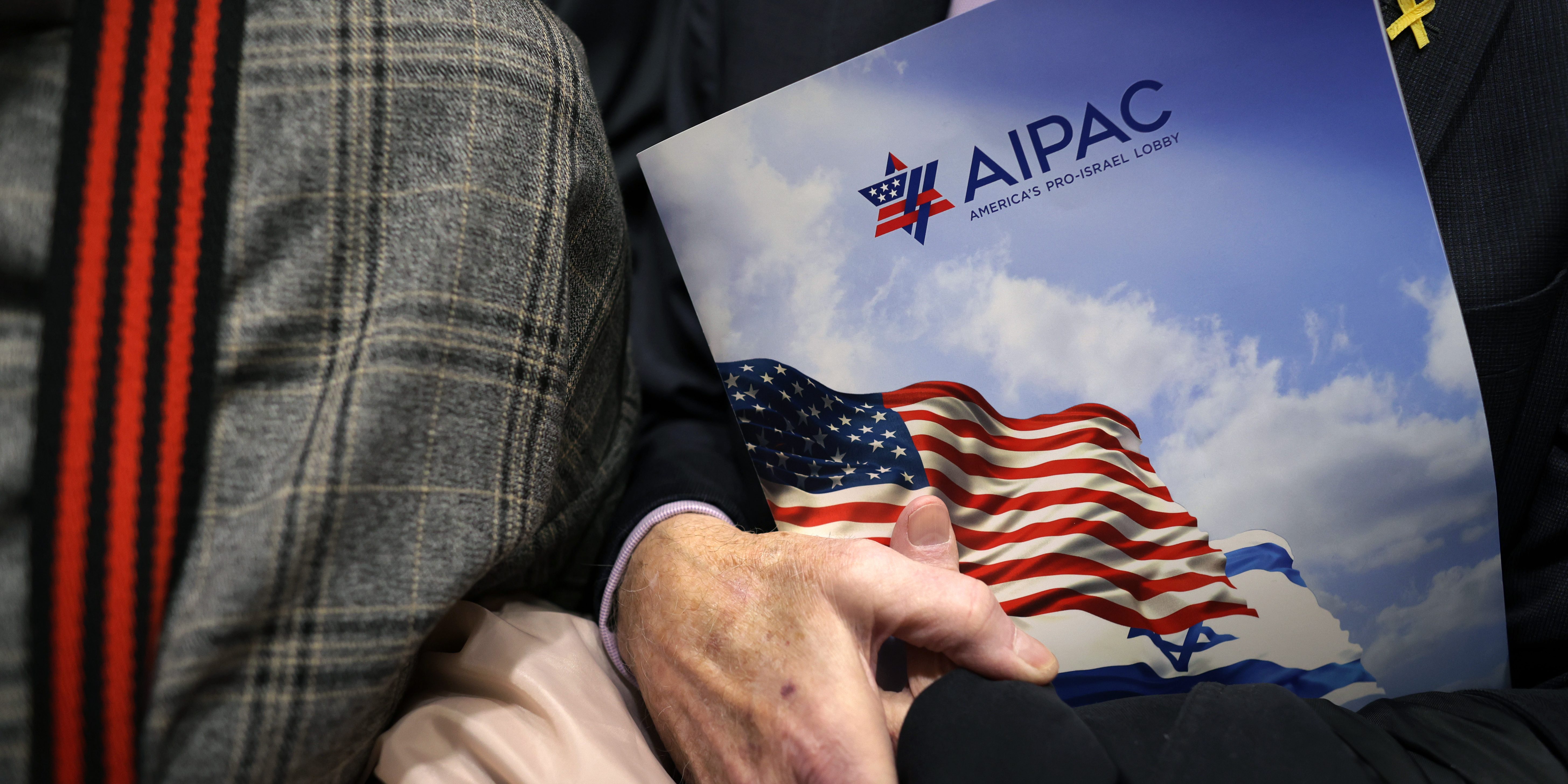 WASHINGTON, DC - MARCH 12: A visitor holds an AIPAC folder in an elevator in Rayburn House Office Building on March 12, 2024 on Capitol Hill in Washington, DC. (Photo by Alex Wong/Getty Images)