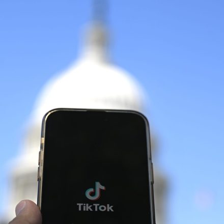 In this photo illustration logo of TikTok is displayed on a mobile phone screen in front of The White House in Washington DC, United States on April 20, 2024. (Photo by Celal Gunes/Anadolu via Getty Images)