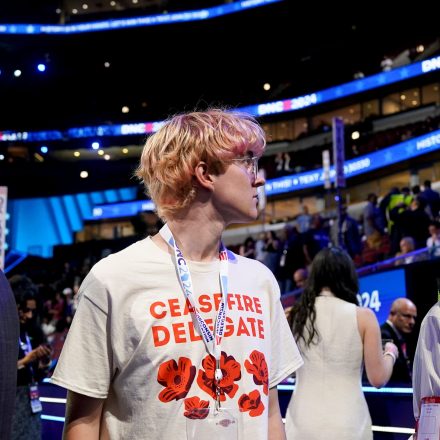 An delegate wears a ceasefire delegate shirt during the Democratic National Convention (DNC) at the United Center in Chicago, Illinois, US, on Monday, Aug. 19, 2024. The race for the White House will reach a fever pitch this week, with Vice President Kamala Harris and Republican nominee Donald Trump battling for momentum, and attention, around the Democratic National Convention in Chicago. Photographer: Al Drago/Bloomberg via Getty Images