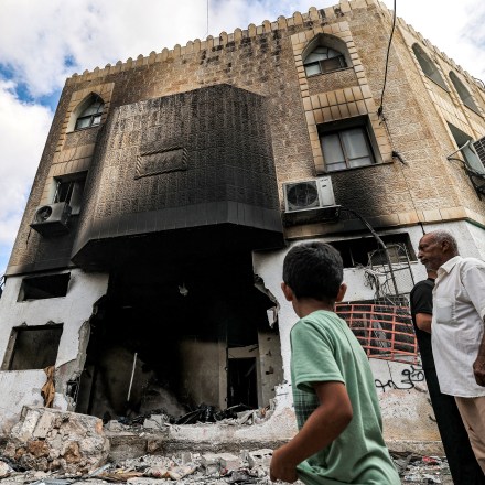People inspect damage to a mosque building following an Israeli military operation in the Fara camp for Palestinian refugees near Tubas in the north of the occupied West Bank on August 29, 2024.