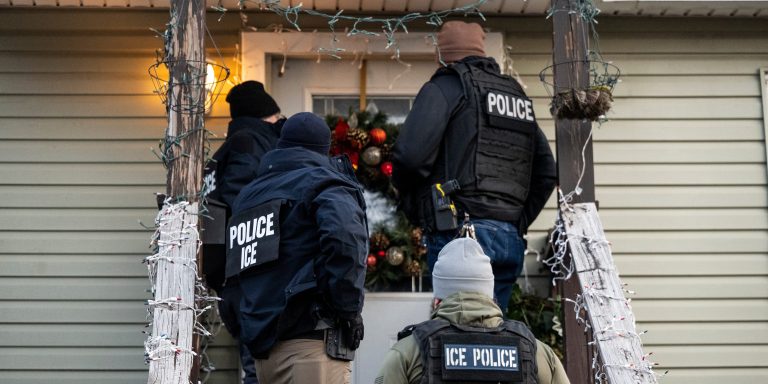 US Immigration and Customs Enforcement (ICE) agents knock on the door of a residence during a multi-agency targeted enforcement operation in Chicago, Illinois, US, on Sunday, Jan. 26, 2025. President Donald Trump has pledged to carry out the largest deportation effort in US history, vowing to ultimately deport all of the foreigners living in the country without permission. Photographer: Christopher Dilts/Bloomberg via Getty Images
