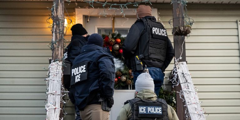 US Immigration and Customs Enforcement (ICE) agents knock on the door of a residence during a multi-agency targeted enforcement operation in Chicago, Illinois, US, on Sunday, Jan. 26, 2025. President Donald Trump has pledged to carry out the largest deportation effort in US history, vowing to ultimately deport all of the foreigners living in the country without permission. Photographer: Christopher Dilts/Bloomberg via Getty Images