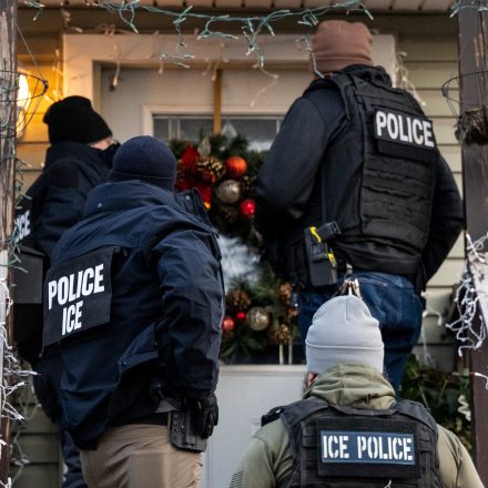 US Immigration and Customs Enforcement (ICE) agents knock on the door of a residence during a multi-agency targeted enforcement operation in Chicago, Illinois, US, on Sunday, Jan. 26, 2025. President Donald Trump has pledged to carry out the largest deportation effort in US history, vowing to ultimately deport all of the foreigners living in the country without permission. Photographer: Christopher Dilts/Bloomberg via Getty Images