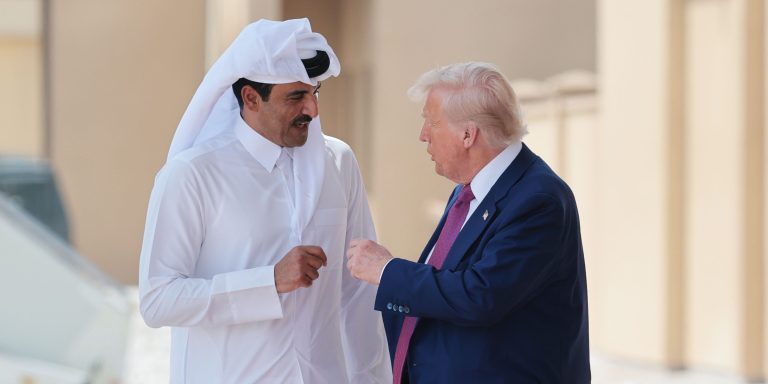 President Donald Trump speaks with Emir of Qatar Tamim bin Hamad al Thani as he departs the Al Udeid Air Base for Abu Dhabi on May 15, 2025, in Doha, Qatar.