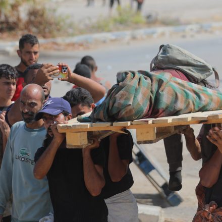 GAZA CITY, GAZA - AUGUST 2: Palestinians killed or injured by the Israeli attack while receiving aid are removed as they surge into the Netzarim Corridor to access the scarce food aid that has been distributed amid ongoing Israeli blockade in Gaza City, Gaza on August 2, 2025. (Photo by Hassan Jedi/Anadolu via Getty Images)
