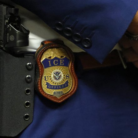ARLINGTON, TEXAS - AUGUST 26:  A detail view of the badge worn by Matthew Elliston, deputy assistant director of field operations at ICE headquarters in Washington. U.S. Immigration and Customs Enforcement (ICE) hold a major hiring event on August 26, 2025 in Arlington, Texas. The federal immigration agency is ramping up recruiting efforts nationwide. (Photo by Ron Jenkins/Getty Images)