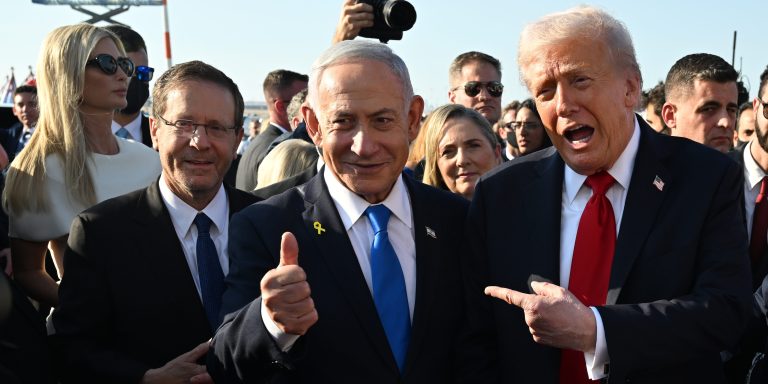 TEL AVIV, ISRAEL - OCTOBER 13:  U.S. President Donald Trump poses with Israeli President Isaac Herzog and Israeli Prime Minister Benjamin Netanyahu at Ben Gurion International Airport before boarding his plane to Sharm El-Sheikh, on October 13, 2025 in Tel Aviv, Israel. President Trump is visiting the country hours after Hamas released the remaining Israeli hostages captured on Oct. 7, 2023, part of a US-brokered ceasefire deal to end the war in Gaza. (Photo by Chip Somodevilla/Getty Images)