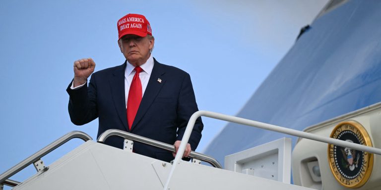 US President Donald Trump gestures to the press as he steps off Air Force One upon arrival at Joint Base Andrews in Maryland on October 30, 2025. The United States is cutting back the number of refugees to be accepted annually to a record low 7,500 and giving priority to white South Africans. The move, published in the official Federal Register on Thursday, comes after President Donald Trump essentially halted refugee arrivals after taking office in January. (Photo by ANDREW CABALLERO-REYNOLDS / AFP) (Photo by ANDREW CABALLERO-REYNOLDS/AFP via Getty Images)