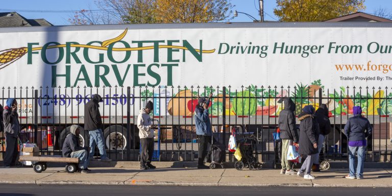 Detroit, Michigan USA, 4 November 2025, People wait in line to pick up groceries from the anti-hunger nonprofit, Forgotten Harvest. Demand for emergency food at food pantries and soup kitchens has risen dramatically since the federal government shutdown cut SNAP benefits.. (Photo by: Jim West/UCG/Universal Images Group via Getty Images)