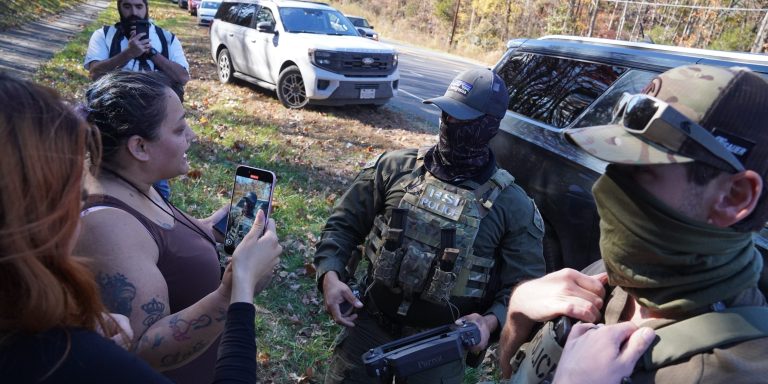 CHARLOTTE, NORTH CAROLINA - NOVEMBER 16: Department of Homeland Security Investigations officers search for two individuals who fled the scene after being stopped while selling flowers on the side of the road on November 16, 2025 in Charlotte, North Carolina. This comes on the second day of "Operation Charlotte's Web," an ongoing immigration enforcement surge across the Charlotte region. (Photo by Ryan Murphy/Getty Images)