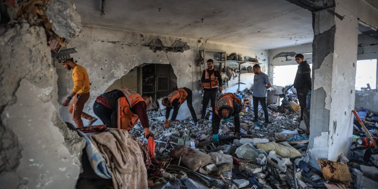 GAZA CITY, GAZA - NOVEMBER 20: Civil defense teams continue search and rescue efforts with limited resources, trying to reach people trapped under the rubble after the Israeli strike in violation of the ceasefire, which left more than ten people dead in Gaza City, Gaza on November 20, 2025. The Waqf building sheltering displaced families in the Zeitoun neighborhood of eastern Gaza City was severely damaged after Israeli forces carried out an attack. (Photo by Hamza Z. H. Qraiqea/Anadolu via Getty Images)