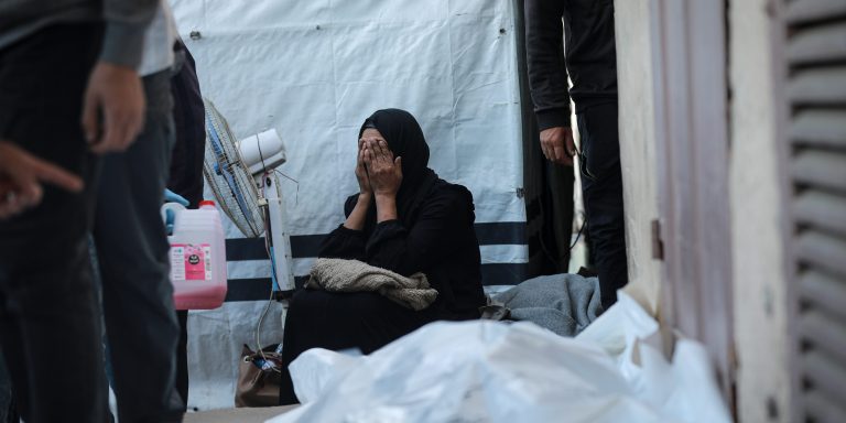 DEIR AL-BALAH, GAZA - NOVEMBER 23: Relatives of Palestinians, who lost their lives in Israeli attacks that violated the ceasefire across several areas of the Gaza Strip, mourn during the funeral which held at the Aqsa Martyrs Hospital in Deir al-Balah, Gaza on November 23, 2025. (Photo by Abdalhkem Abu Riash/Anadolu via Getty Images)