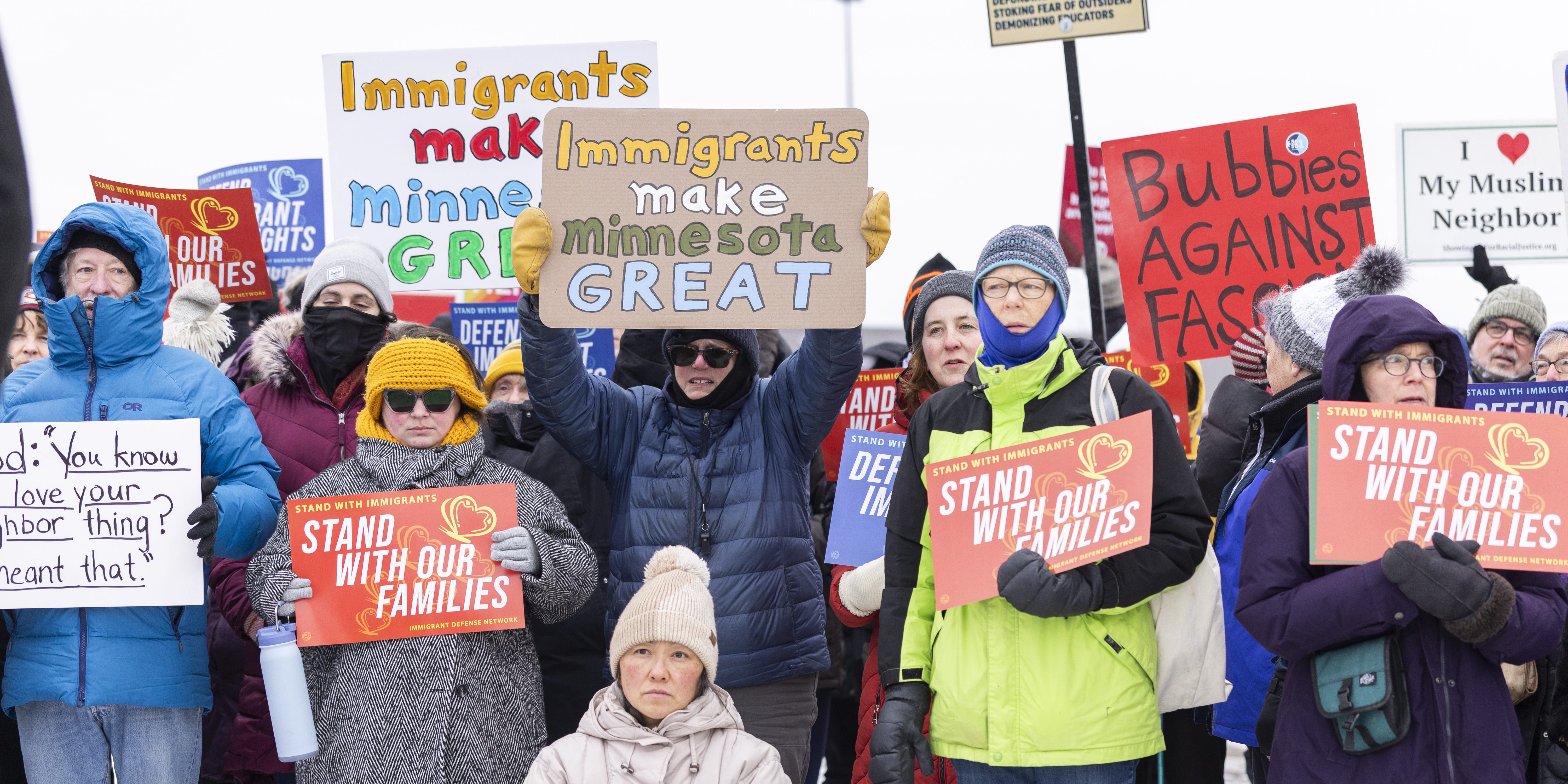 MINNEAPOLIS, USA - DECEMBER 4: Community members hold banners as they show up to a press conference to demand accountability from Target after ICE agents were spotted staging at the parking lot in Minneapolis, USA on December 4, 2025. (Photo by Christopher Juhn/Anadolu via Getty Images)