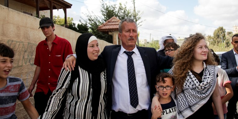 Basem (C), Ahed (R) and Nariman Tamimi arive in Nabi Saleh following the women's release on July 29, 2018.