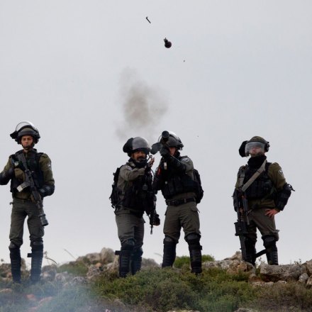 Israeli troops fire teargas at protesters during a clashes following a protest to mark the Land Day, in the village of Qusra, near the West Bank City of Nablus, Friday, March 30, 2018. (AP Photo/Majdi Mohammed)